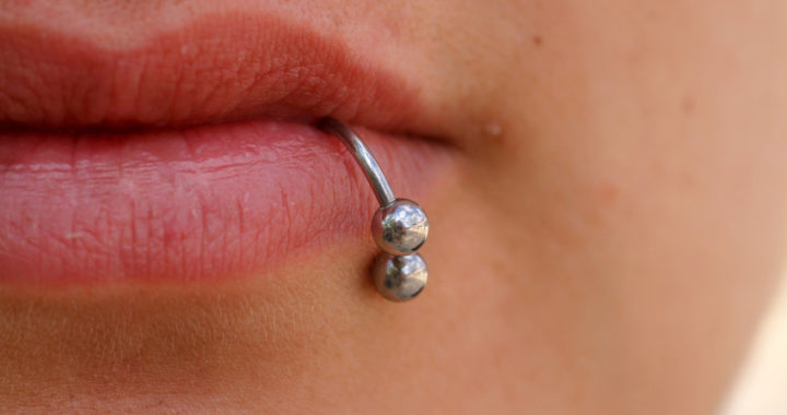 Close-up of lips and piercings