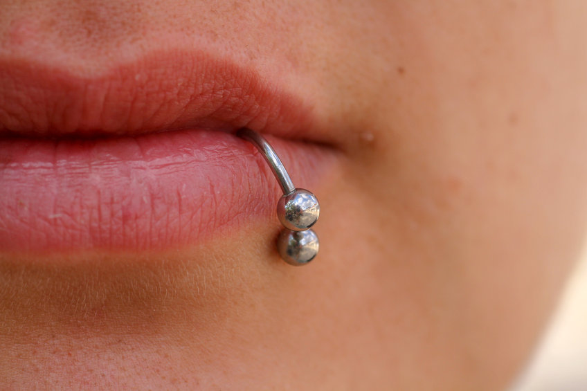 Close-up of lips and piercings